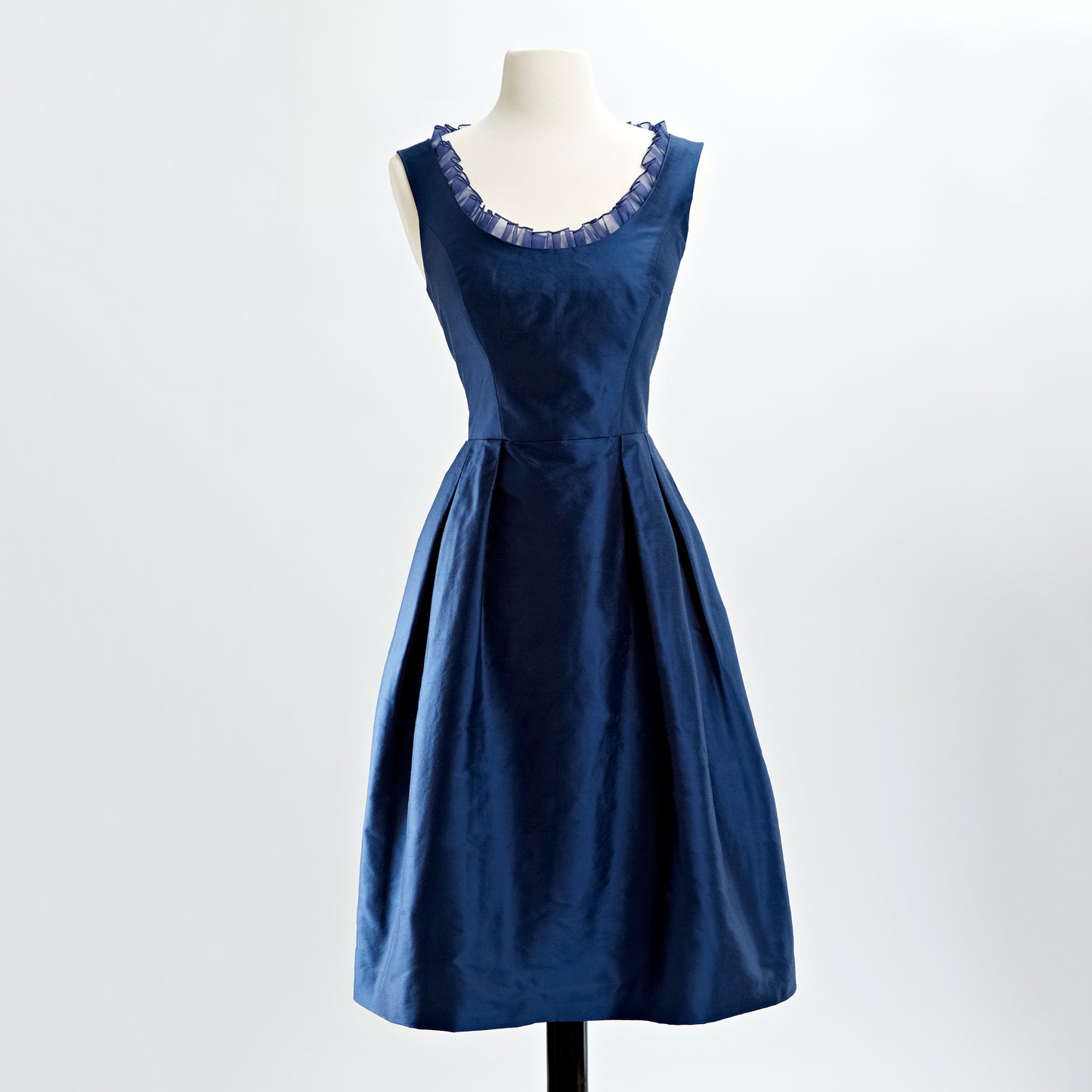 Cobalt blue shantung cocktail dress with scoop neck with inset organza ruffle and pleated skirt