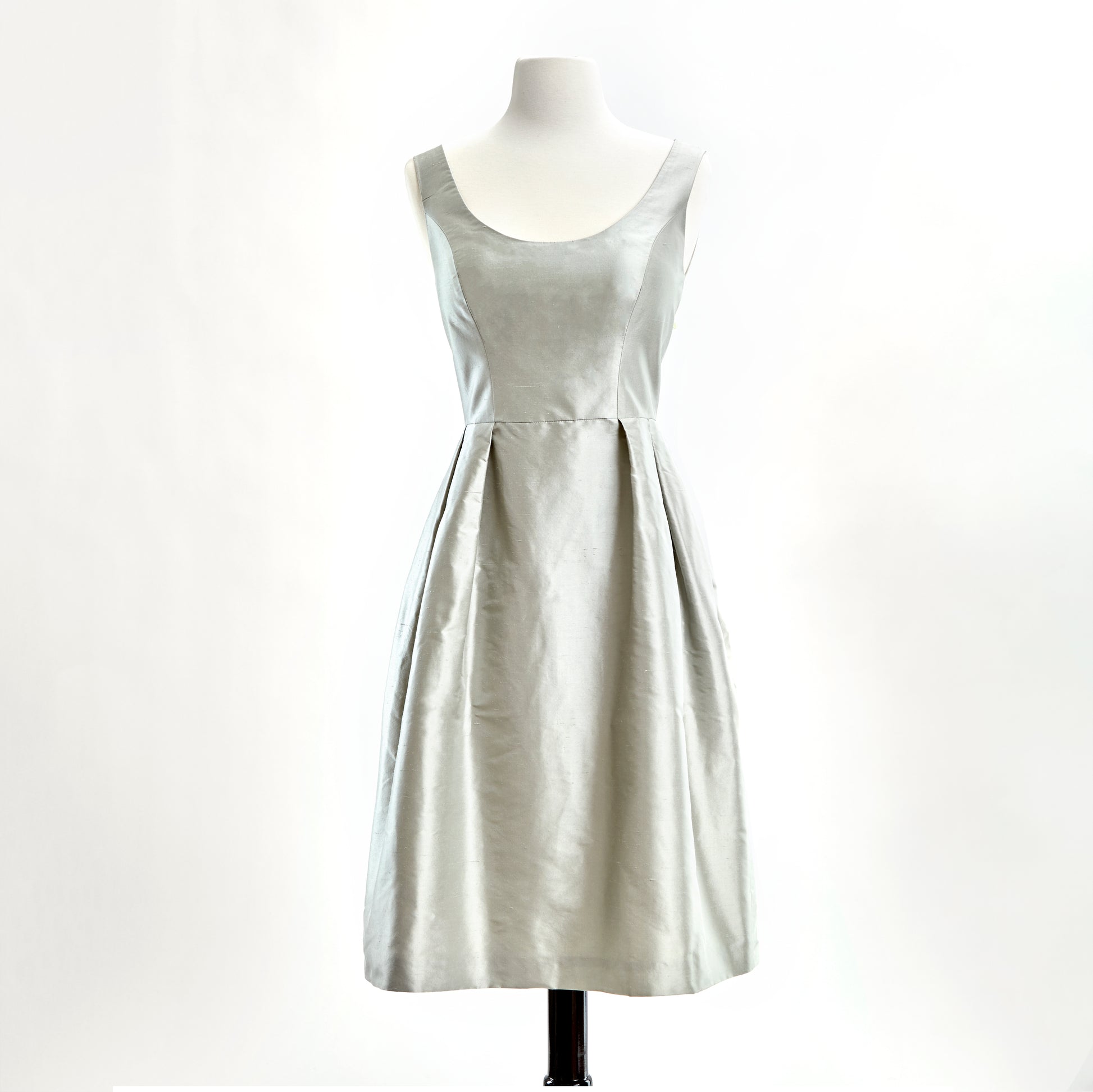 Silver shantung dress with scoop neck and pleated skirt