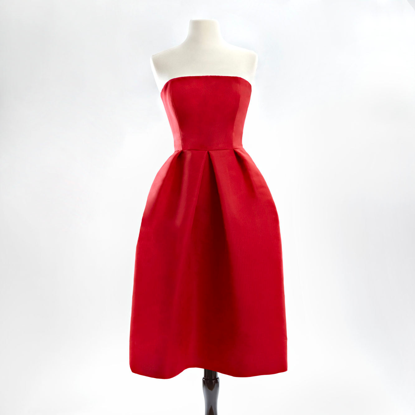 Red strapless silk faille cocktail dress with a full skirt